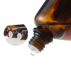 Garrafa vazia de Amber Cosmetic Essential Oil Glass com o tampão evidente da calcadeira